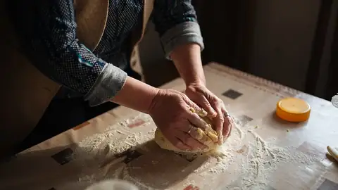 Hands kneading dough